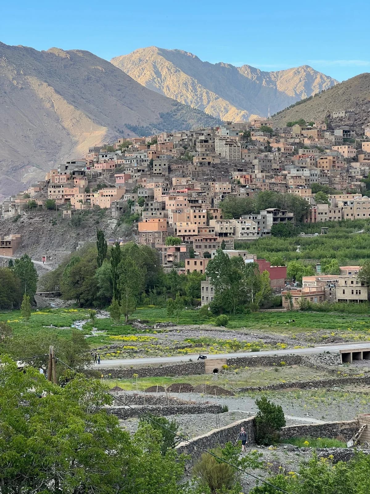 A village and cultivated terraces beneath the Atlas Mountains