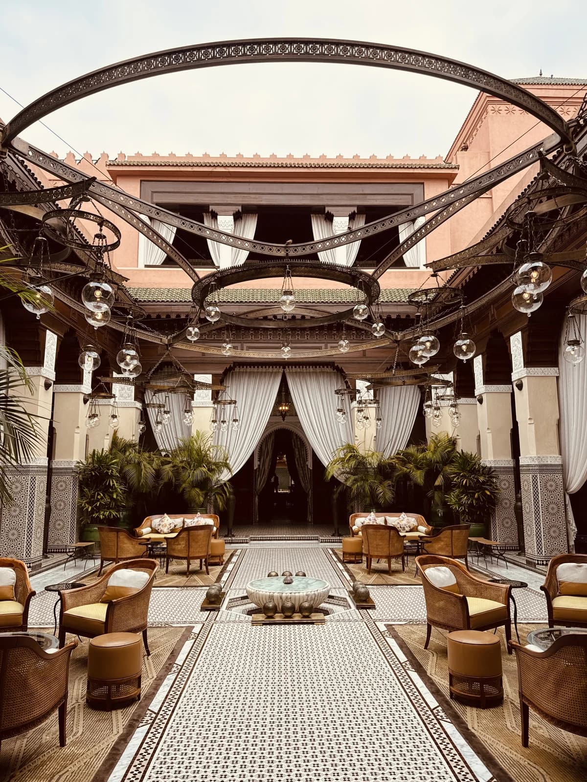 Seating and an open courtyard inside a Marrakech riad