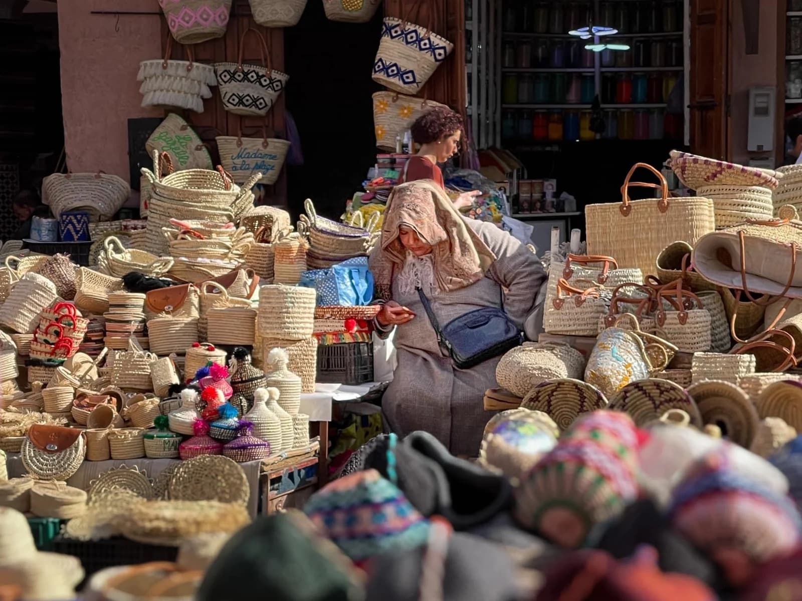 Woven baskets and craft objects displayed at a Marrakech stall